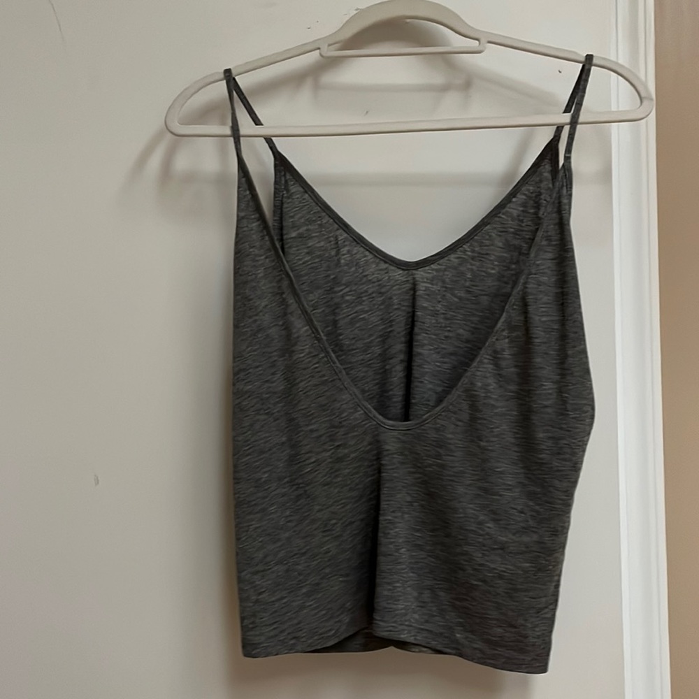 Open back tank (first picture is the back). Both tank tops  avail for purchase